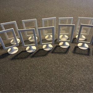IKEA tolsby 4x6 in white plastic picture frames.